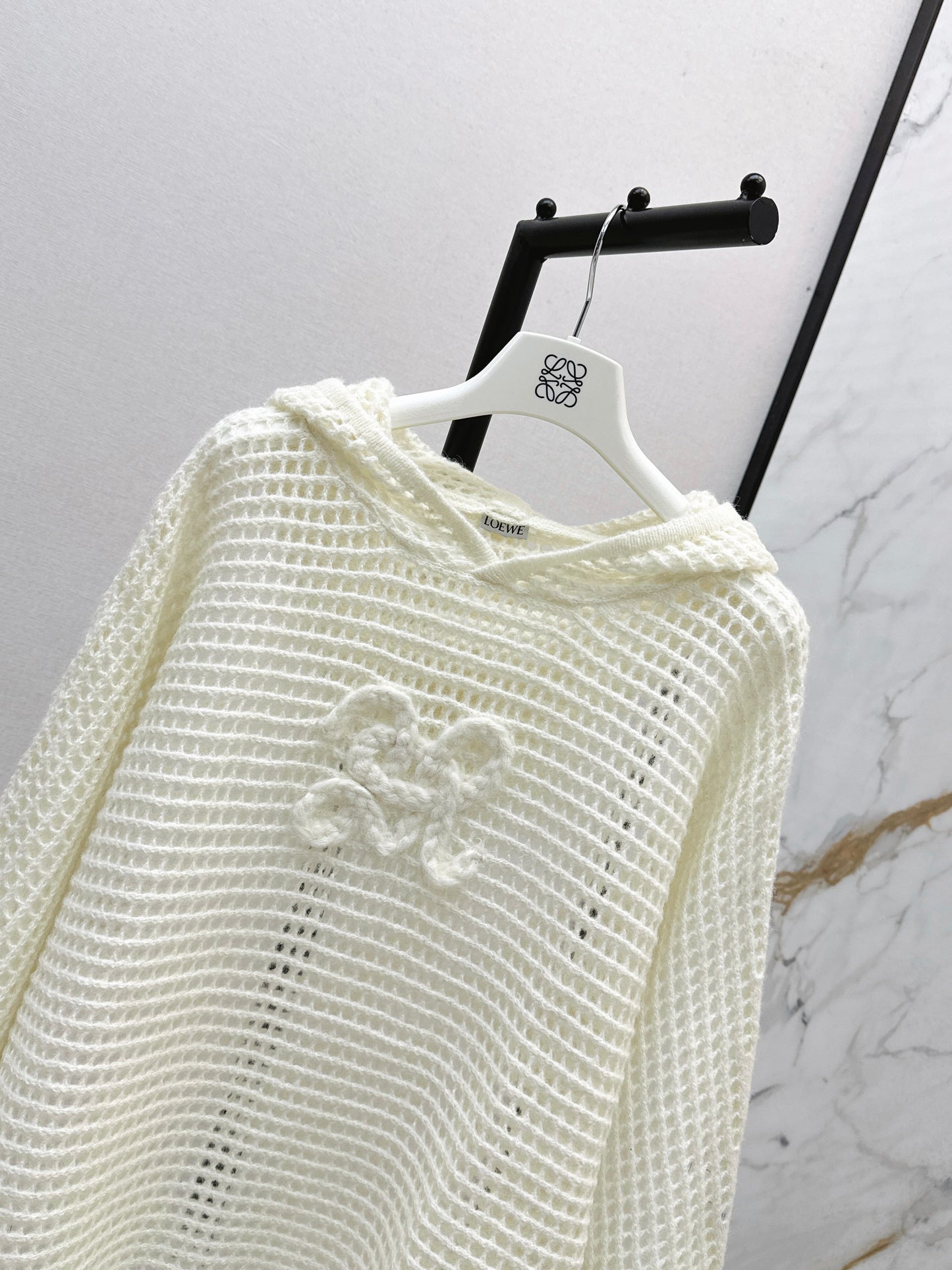 The latest autumn and winter three-dimensional crochet pattern hooded hollow knit sweater