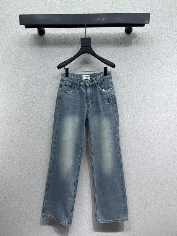 Denim trousers with embossed logo on pocket