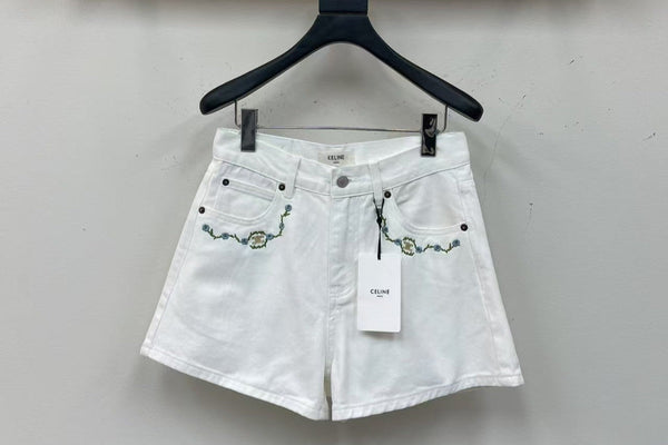 White denim shorts with embroidered letters